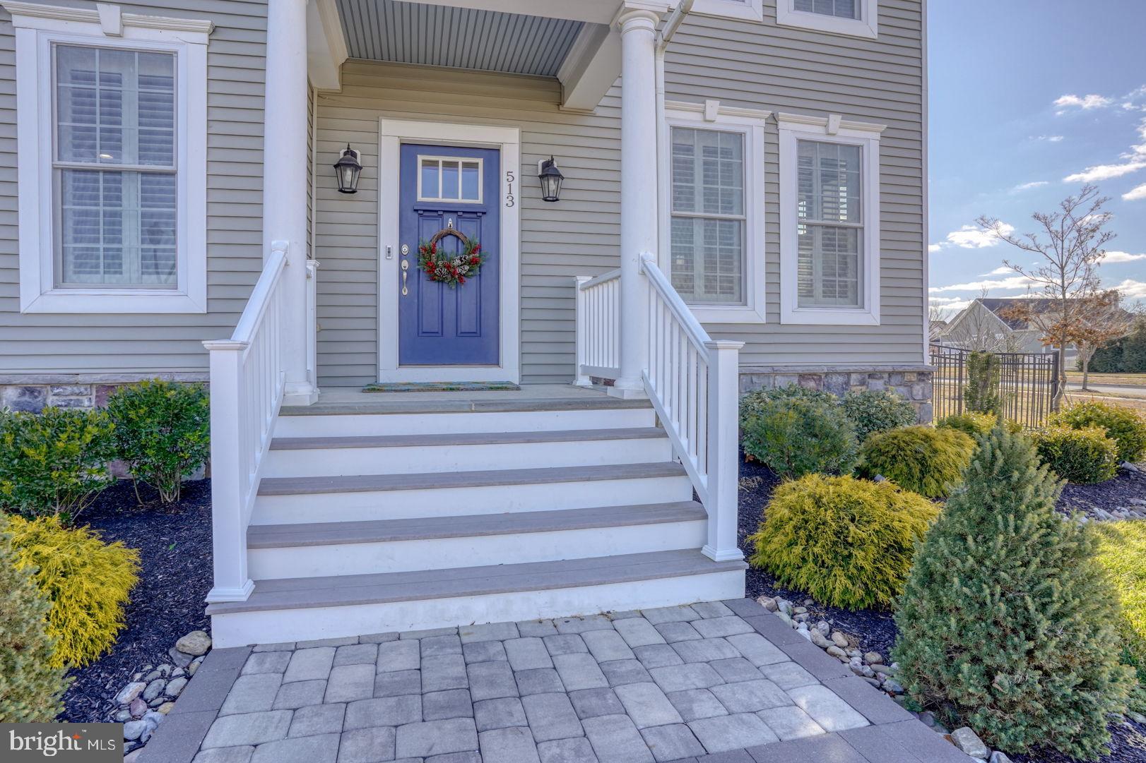 513 Spring Hollow Drive Middletown, DE 19709 - Photo 7 of 83 a view of a house with potted plants and a potted plant