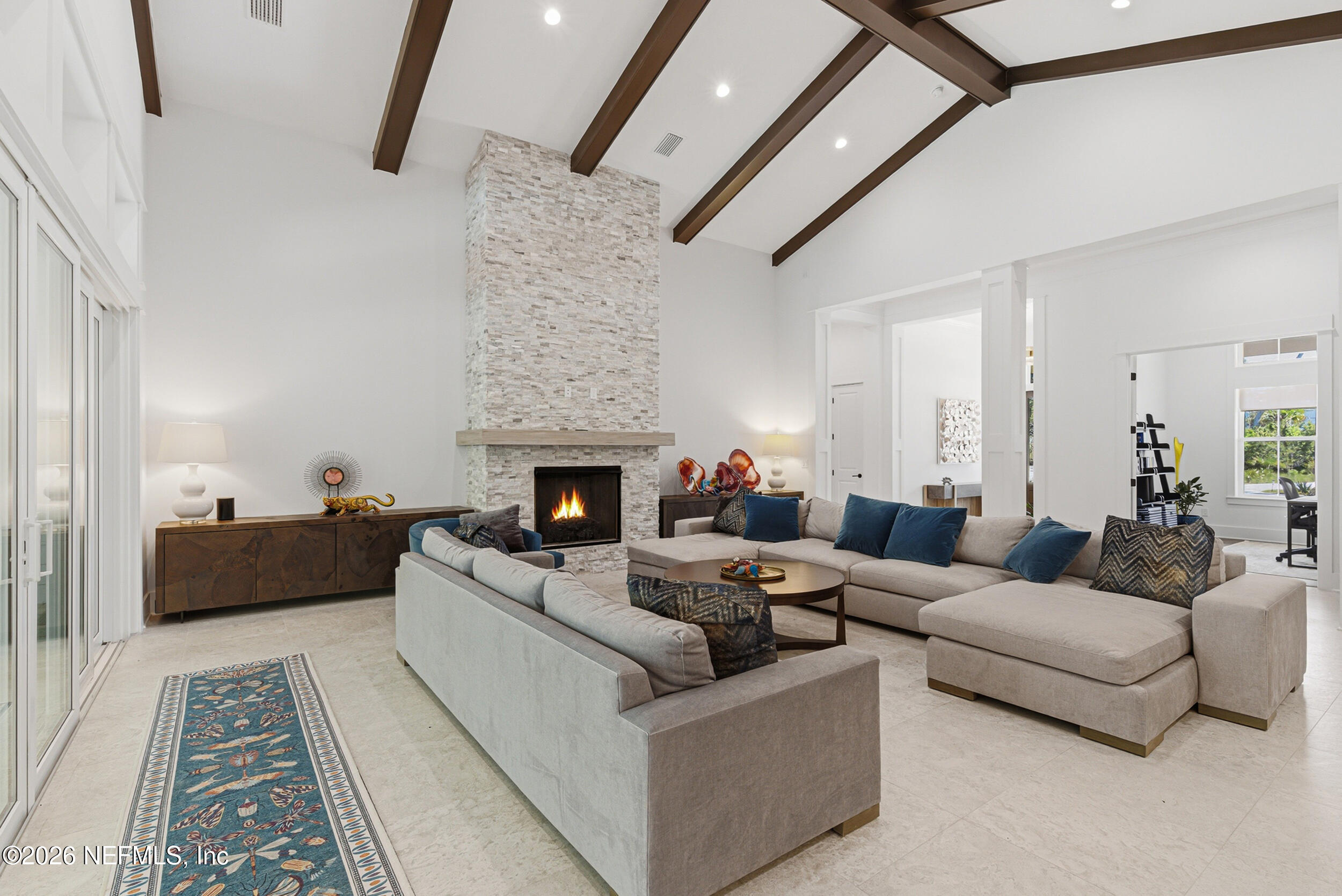 4640 Palm Vly Road Ponte Vedra Beach, FL 32082 - Photo 13 of 72 a living room with furniture and a fireplace