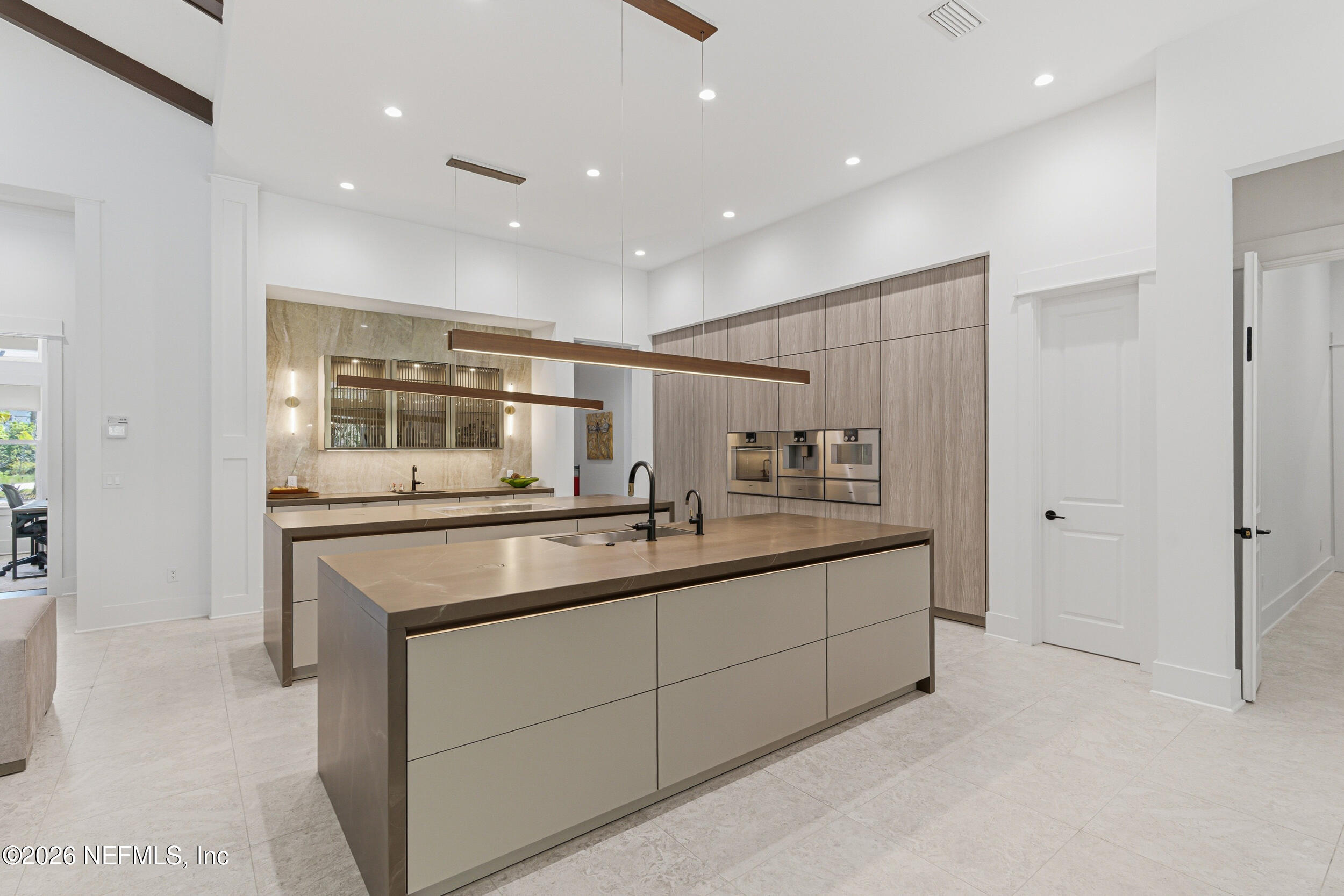 4640 Palm Vly Road Ponte Vedra Beach, FL 32082 - Photo 14 of 72 a kitchen with counter top space sink and center island