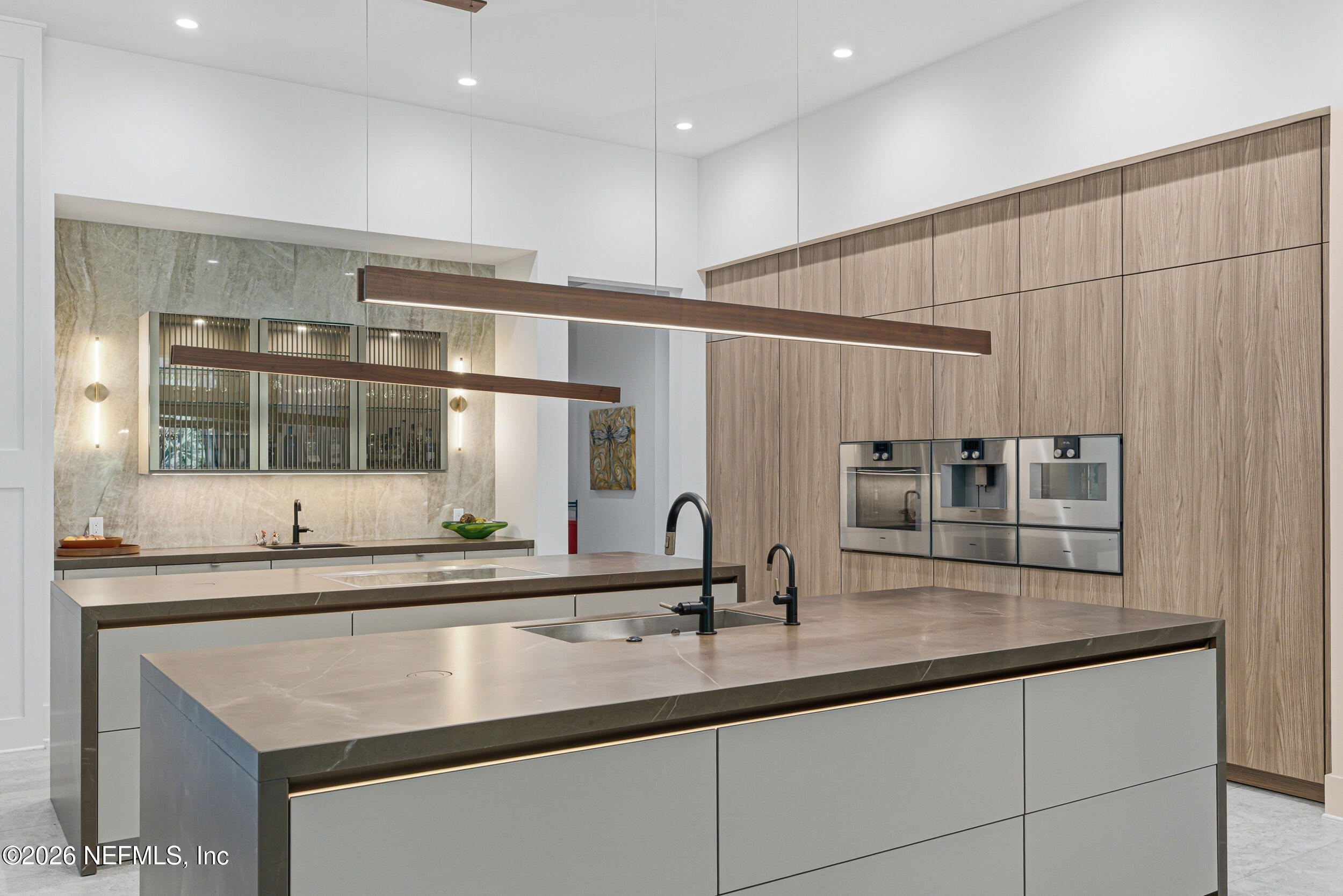 4640 Palm Vly Road Ponte Vedra Beach, FL 32082 - Photo 20 of 72 a kitchen with stainless steel appliances a sink and a large mirror