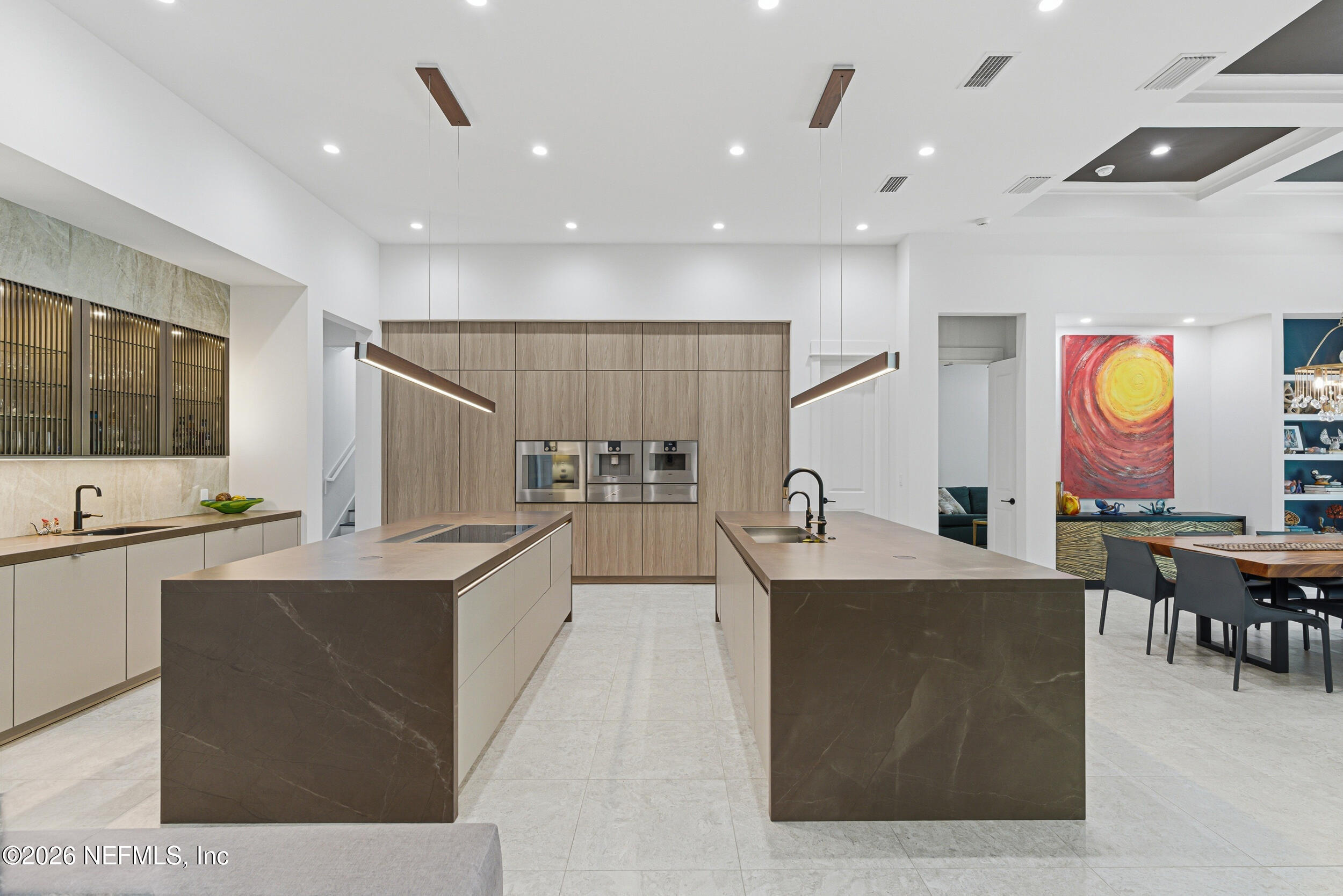 4640 Palm Vly Road Ponte Vedra Beach, FL 32082 - Photo 21 of 72 a large kitchen with kitchen island a sink table and chairs