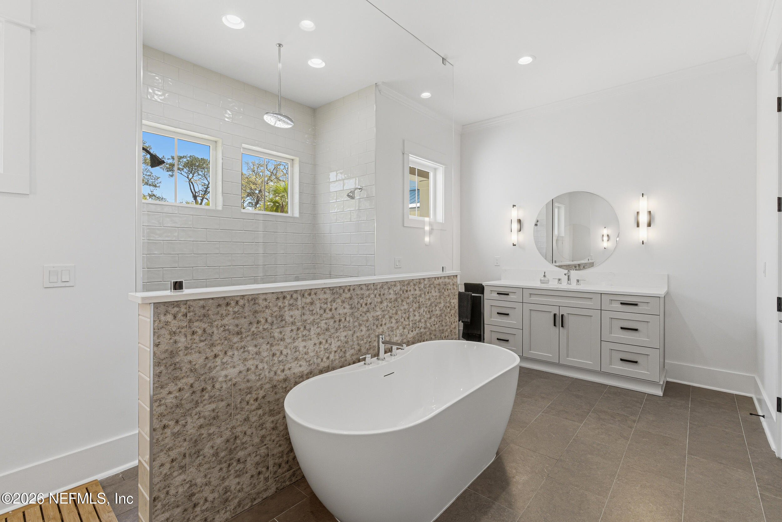 4640 Palm Vly Road Ponte Vedra Beach, FL 32082 - Photo 32 of 72 a spacious bathroom with a double vanity sink a mirror and a bathtub