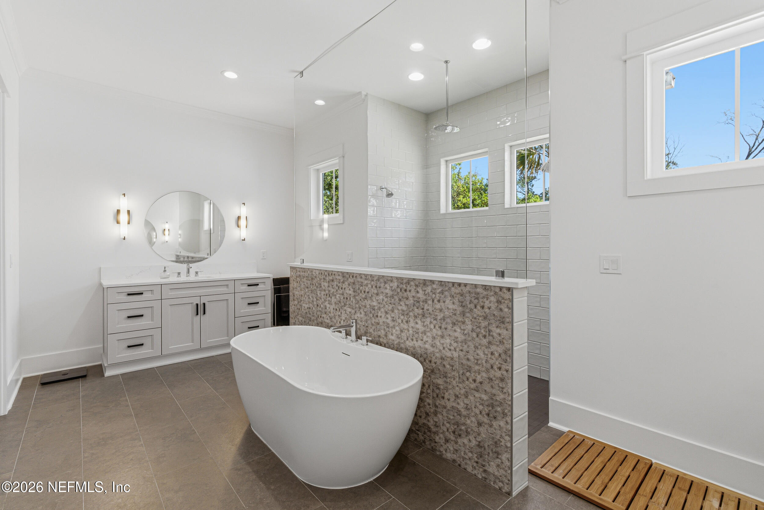4640 Palm Vly Road Ponte Vedra Beach, FL 32082 - Photo 34 of 72 a spacious bathroom with a tub sink and mirror