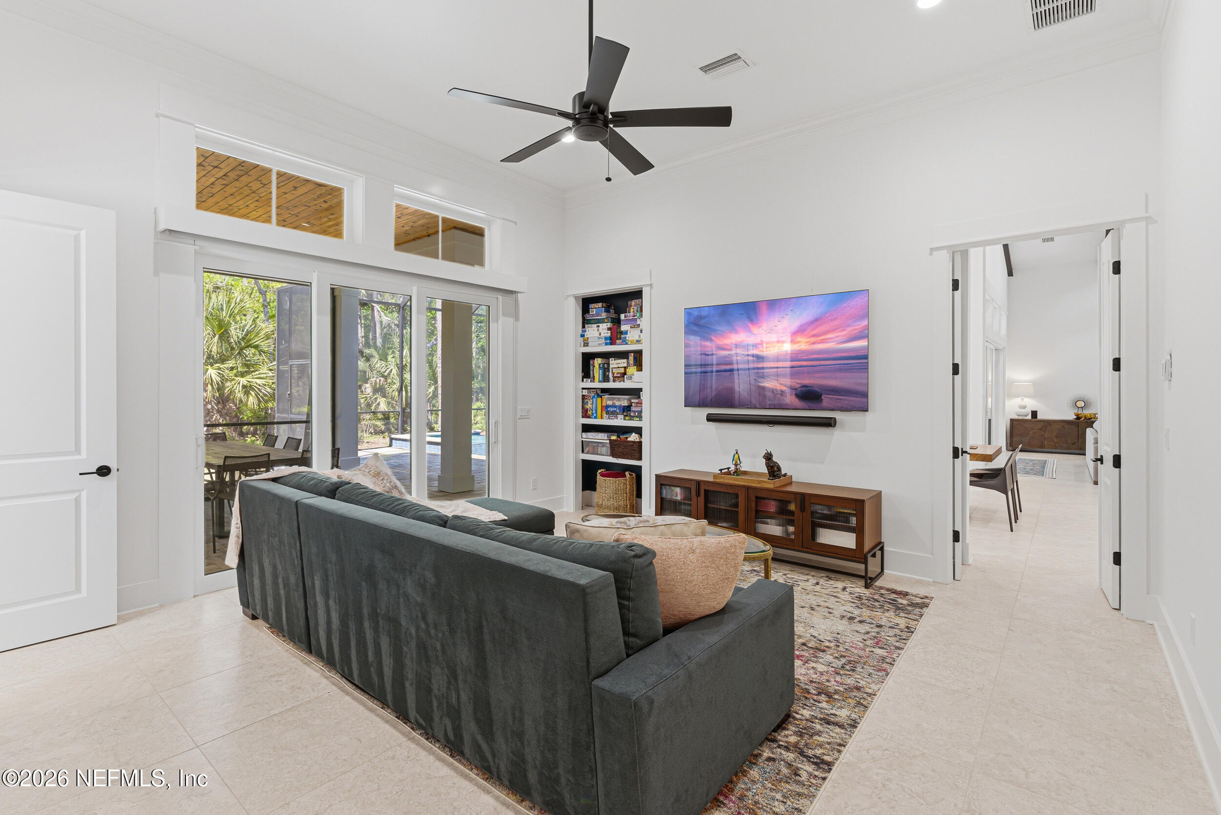 4640 Palm Vly Road Ponte Vedra Beach, FL 32082 - Photo 36 of 72 a living room with furniture and a flat screen tv