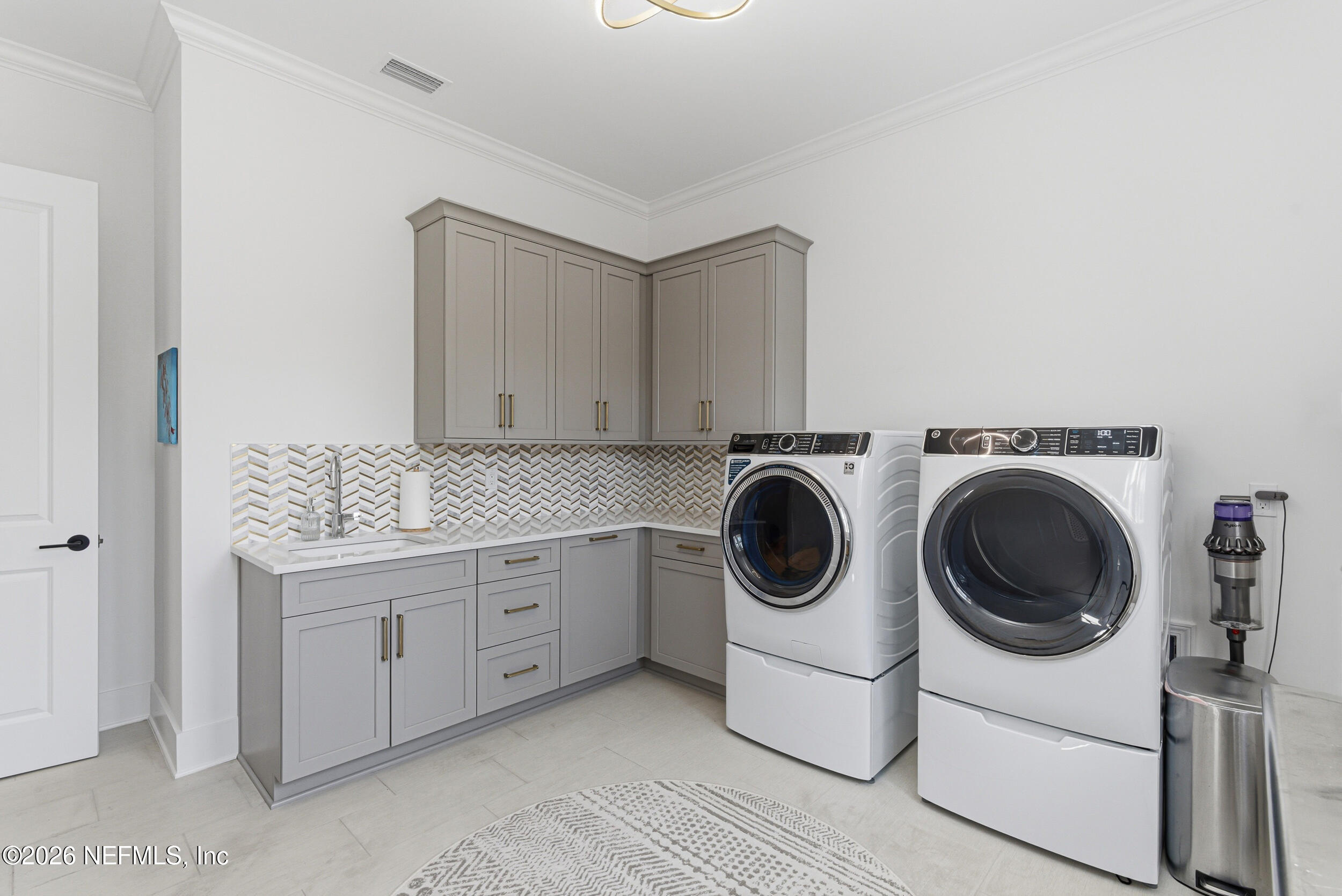 4640 Palm Vly Road Ponte Vedra Beach, FL 32082 - Photo 40 of 72 a utility room with sink dryer and washer