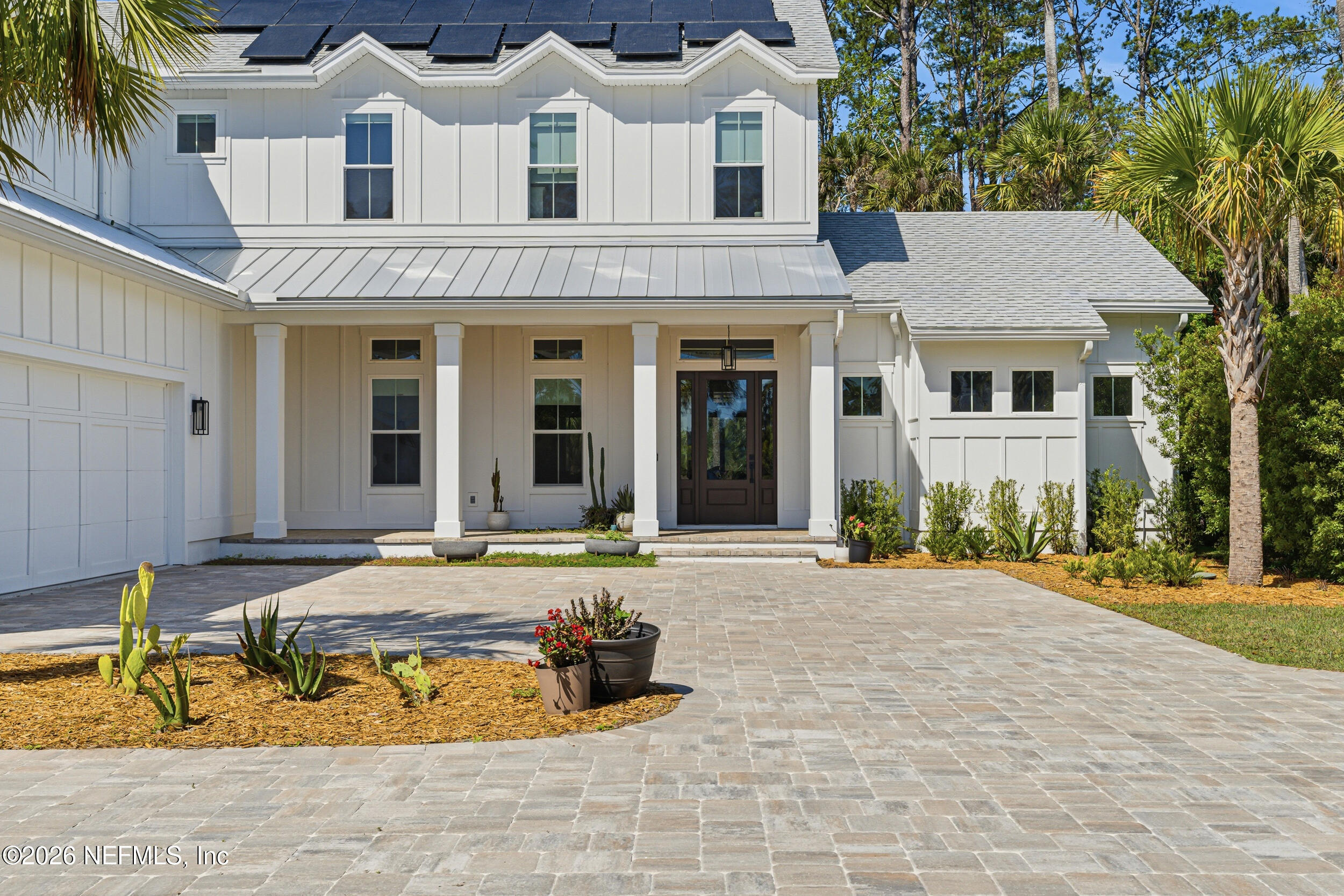 4640 Palm Vly Road Ponte Vedra Beach, FL 32082 - Photo 4 of 72 a view of a white house with swimming pool in front of it