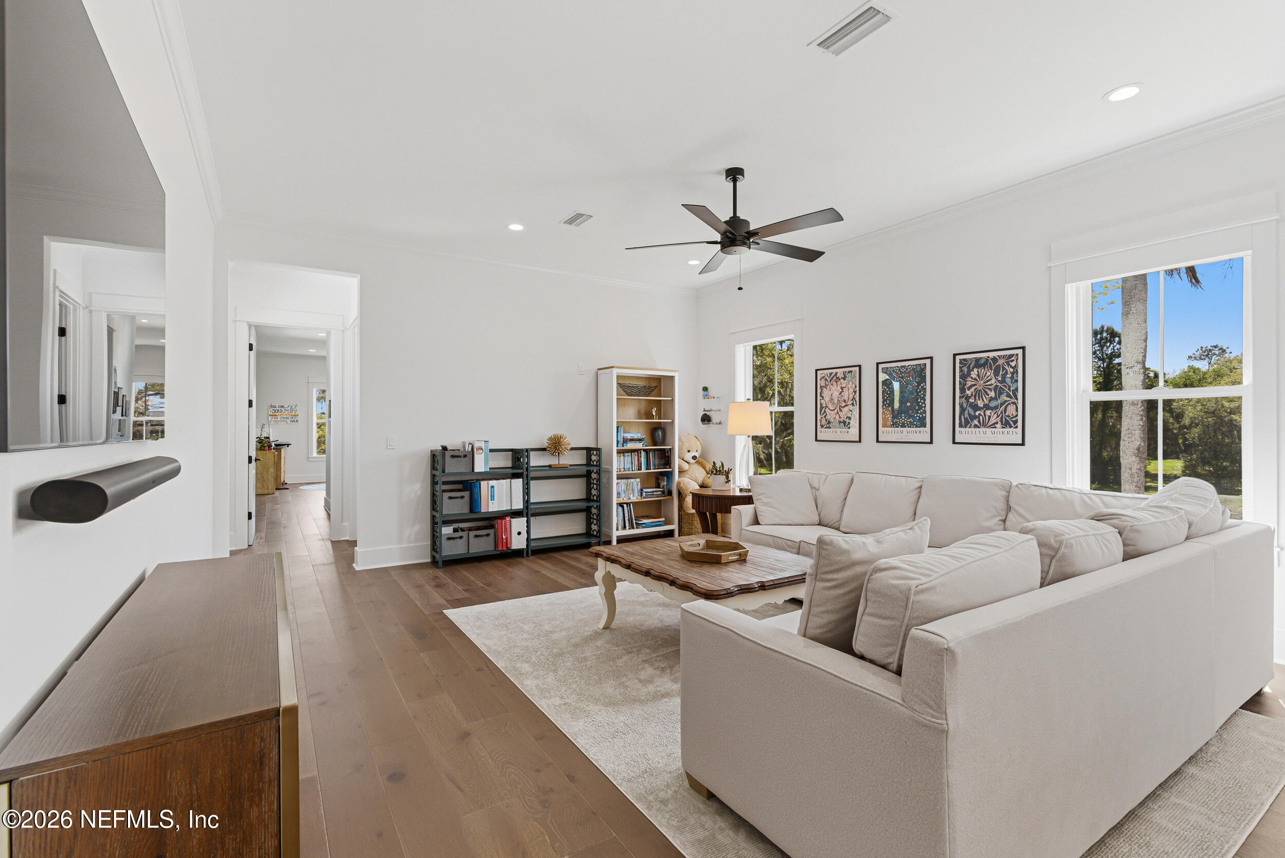 4640 Palm Vly Road Ponte Vedra Beach, FL 32082 - Photo 42 of 72 a living room with furniture and a flat screen tv