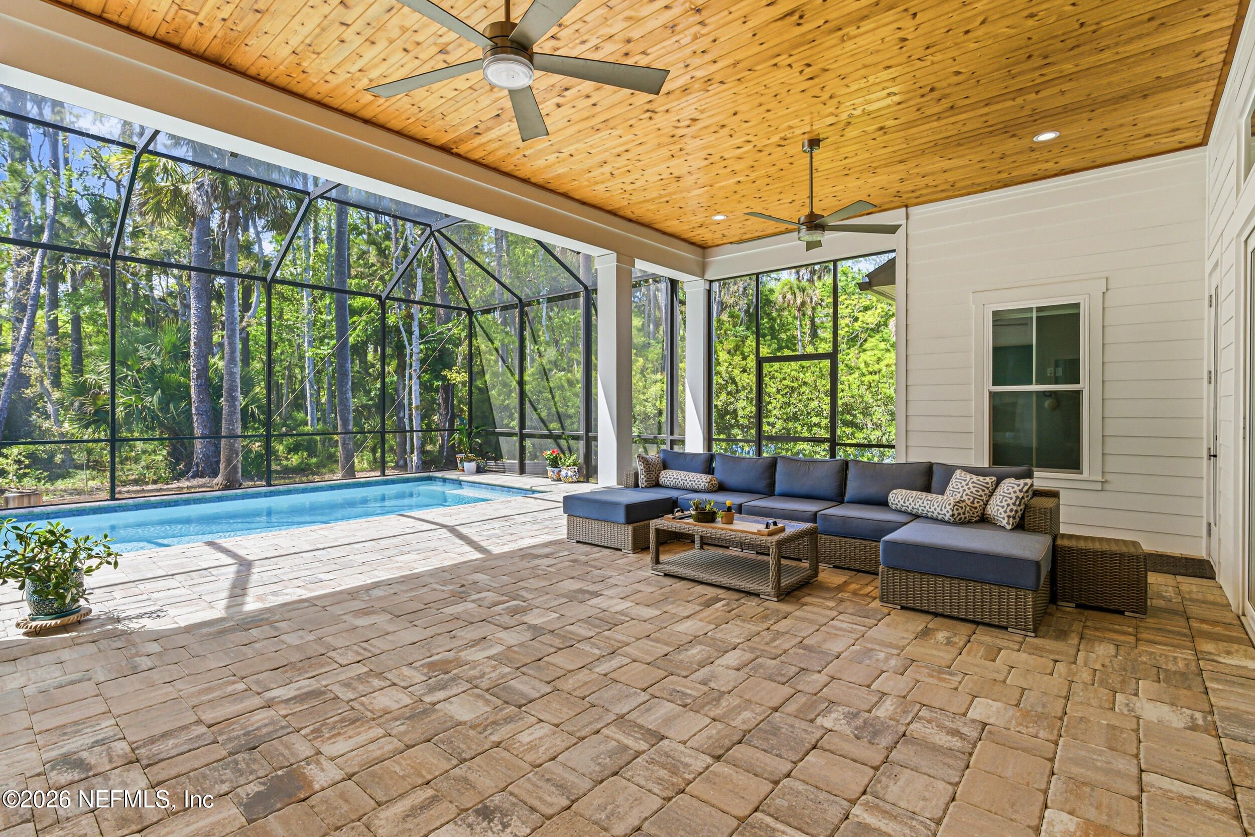 4640 Palm Vly Road Ponte Vedra Beach, FL 32082 - Photo 56 of 72 a living room with furniture and floor to ceiling windows
