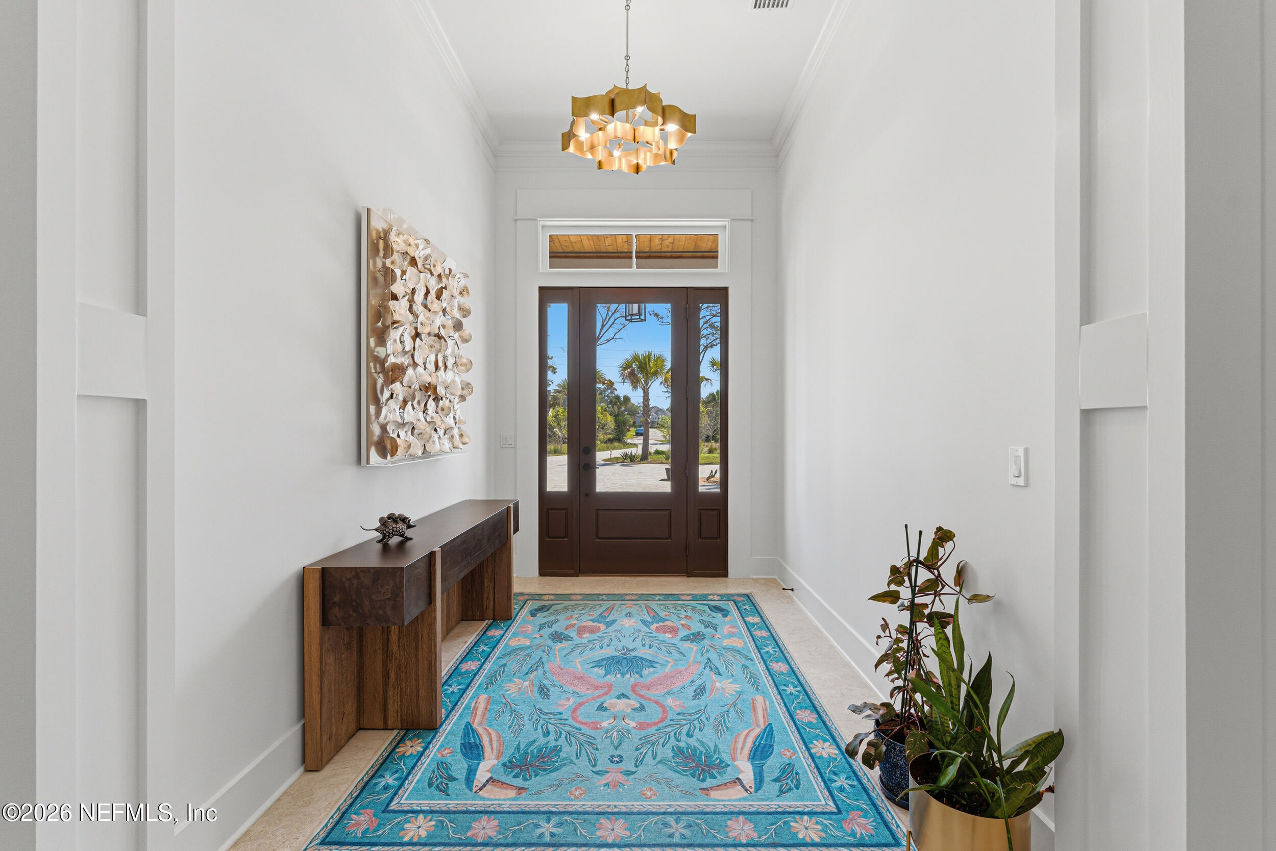 4640 Palm Vly Road Ponte Vedra Beach, FL 32082 - Photo 8 of 72 a hallway with painting on the wall and a potted plant