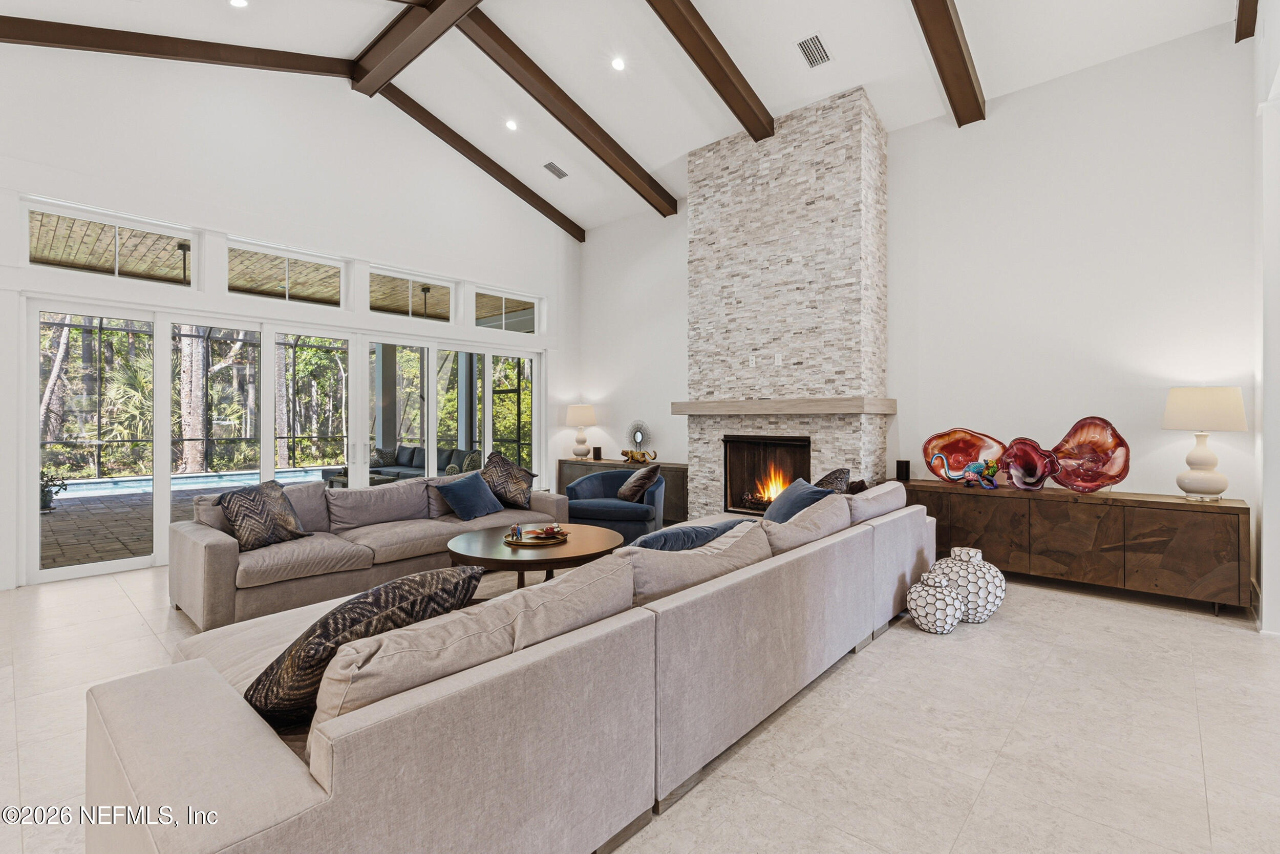 4640 Palm Vly Road Ponte Vedra Beach, FL 32082 - Photo 10 of 72 a living room with furniture fireplace and a flat screen tv