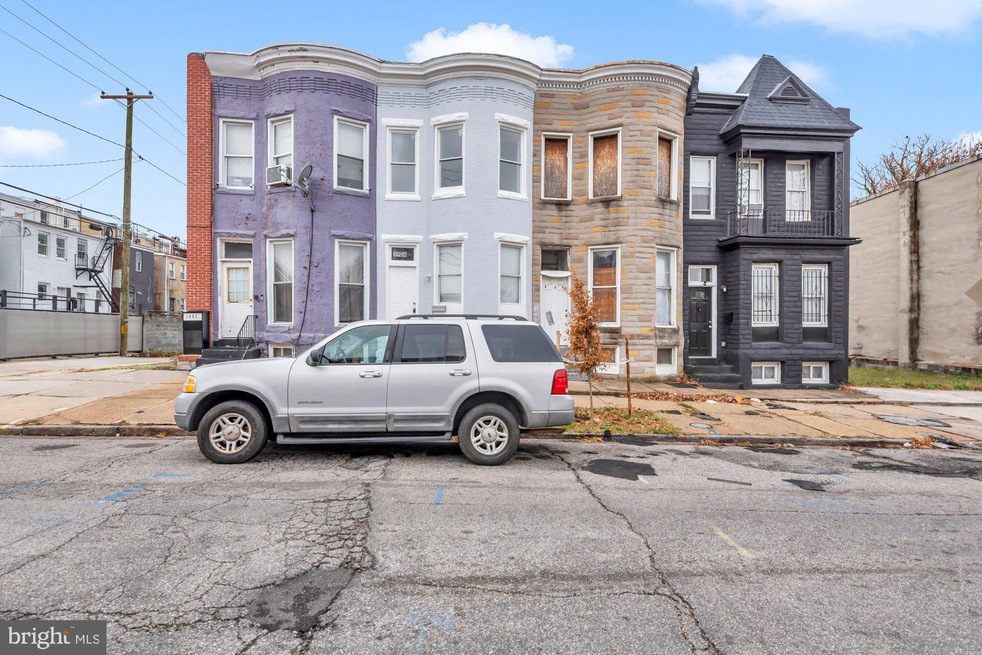 1904 Kennedy Avenue Baltimore, MD 21218 - Photo 1 of 29 a car parked in front of a house