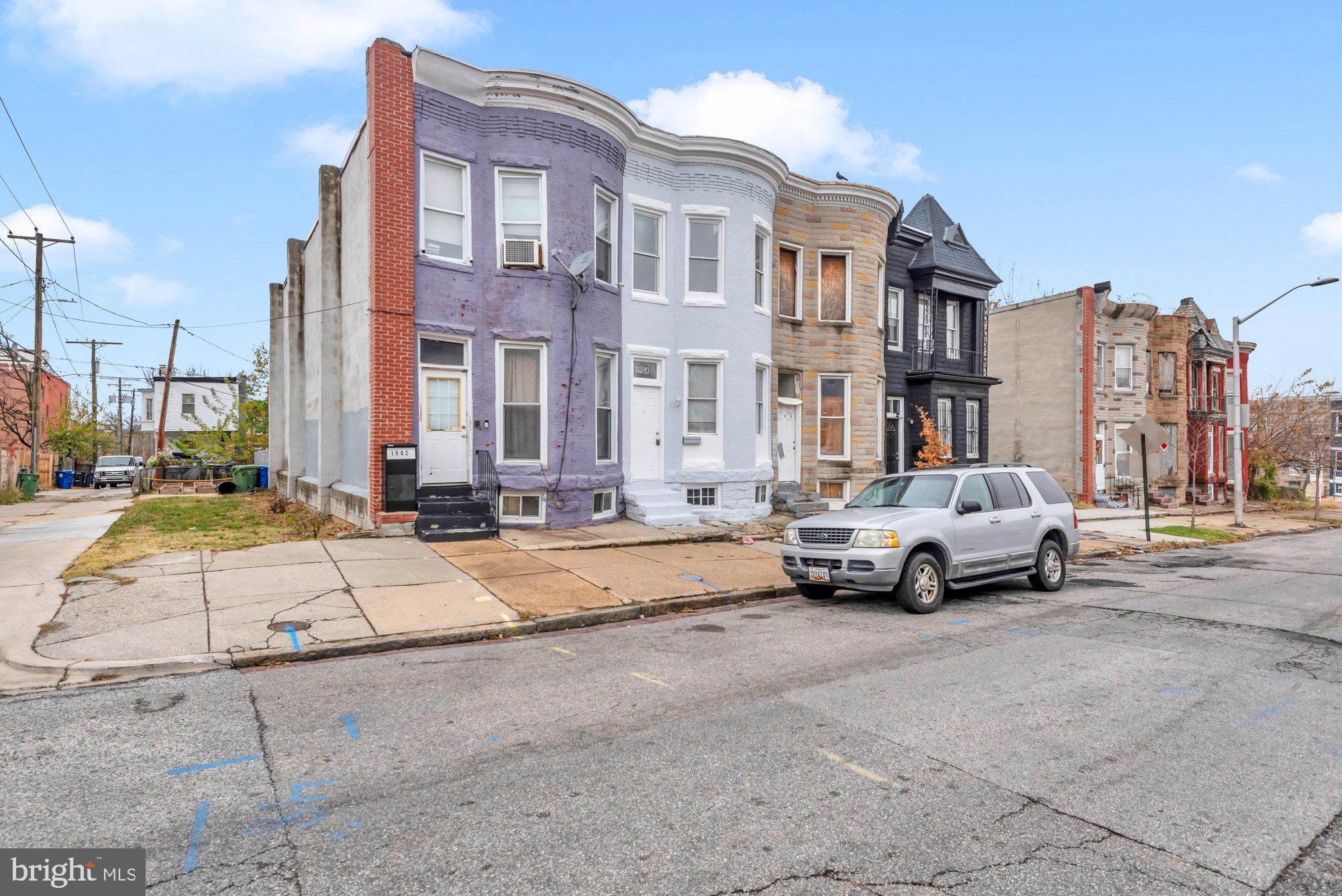 1904 Kennedy Avenue Baltimore, MD 21218 - Photo 2 of 29 a parked cars is parked on the side of a street