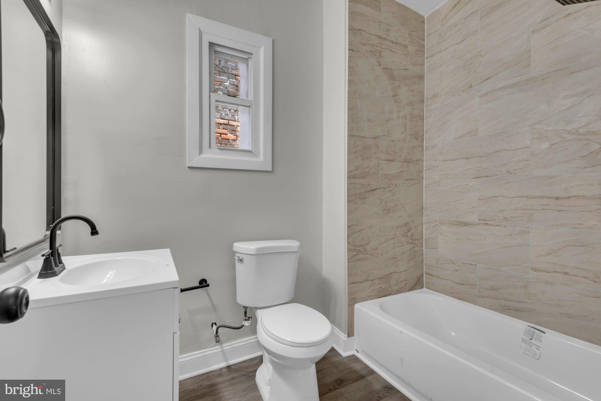 1904 Kennedy Avenue Baltimore, MD 21218 - Photo 21 of 29 a bathroom with a toilet sink and bathtub