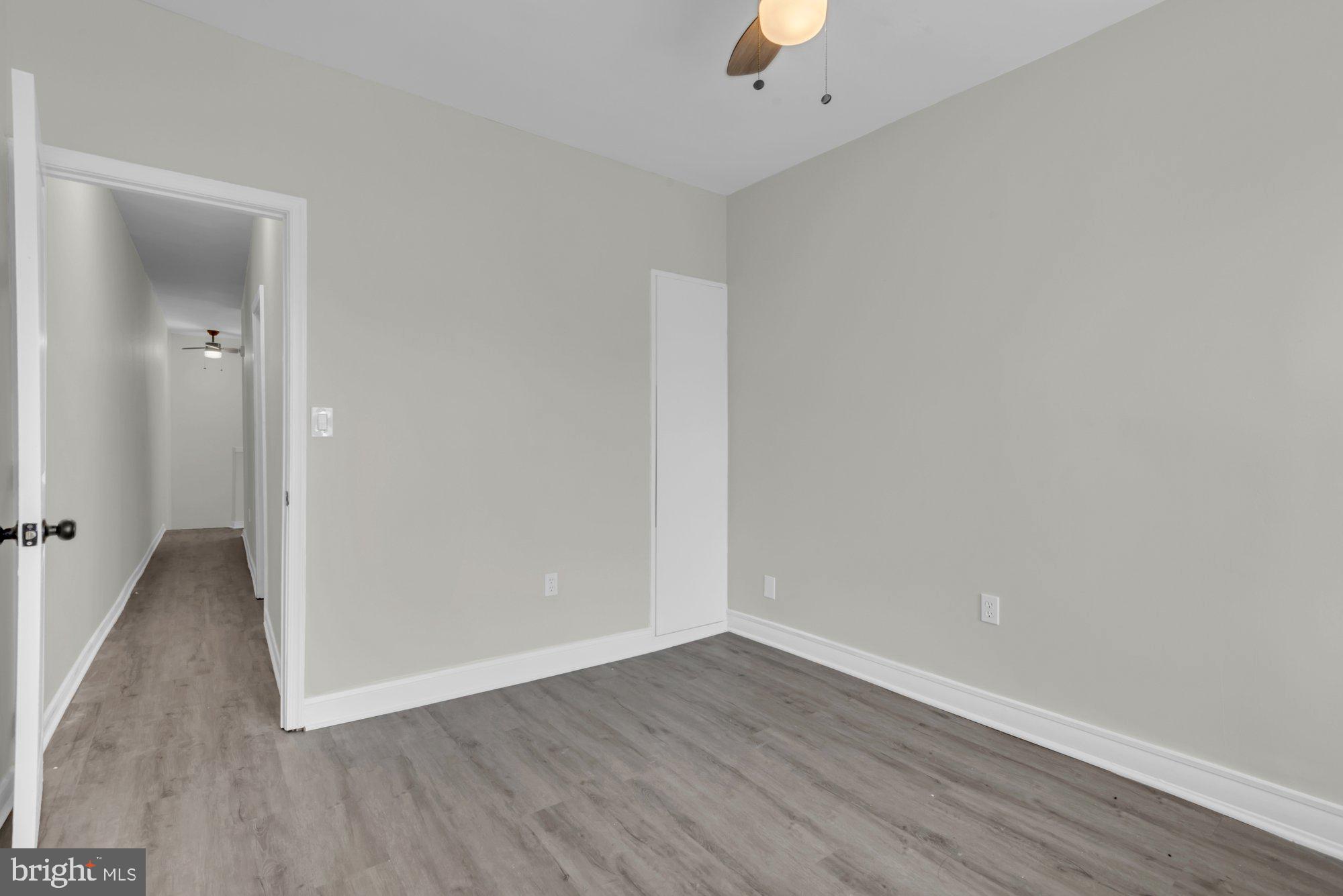 1904 Kennedy Avenue Baltimore, MD 21218 - Photo 23 of 29 wooden floor in an empty room
