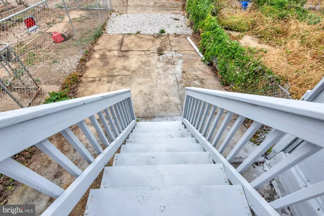 a view of entryway with wooden stairs