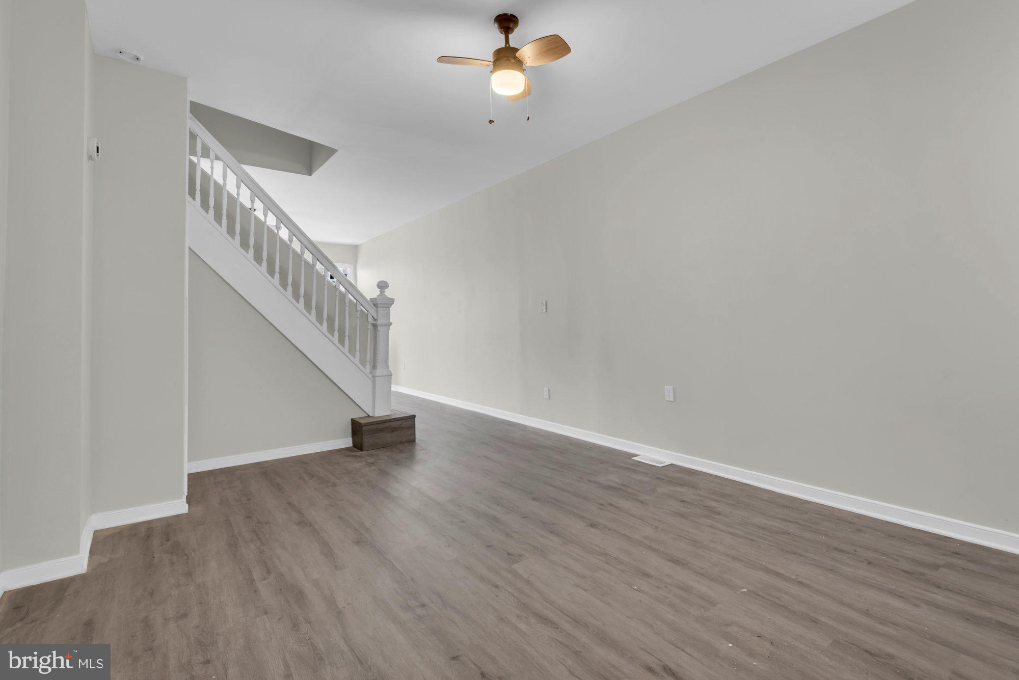 1904 Kennedy Avenue Baltimore, MD 21218 - Photo 10 of 29 a view of a room with wooden floor and white walls