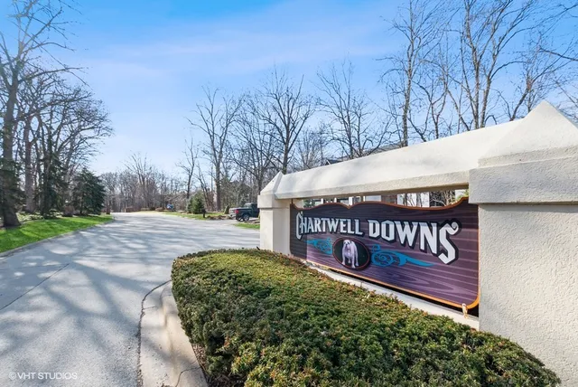 a wooden bench sitting in middle of a field