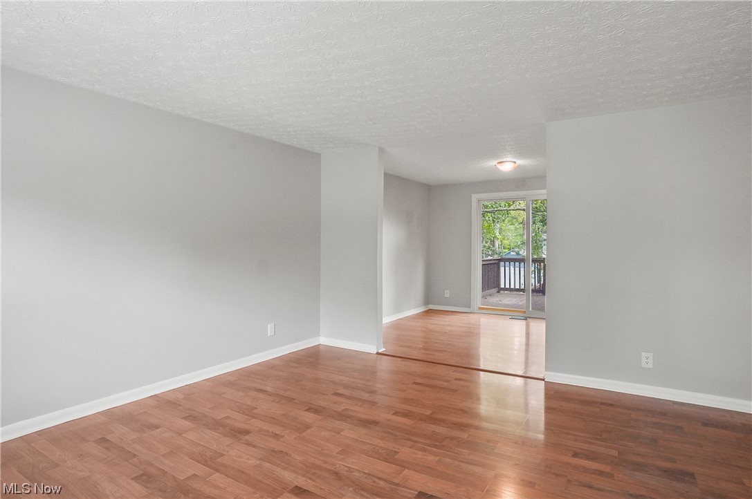 4252 Hile Road Stow, OH 44224 - Photo 4 of 31 Empty room featuring a textured ceiling and light hardwood floors