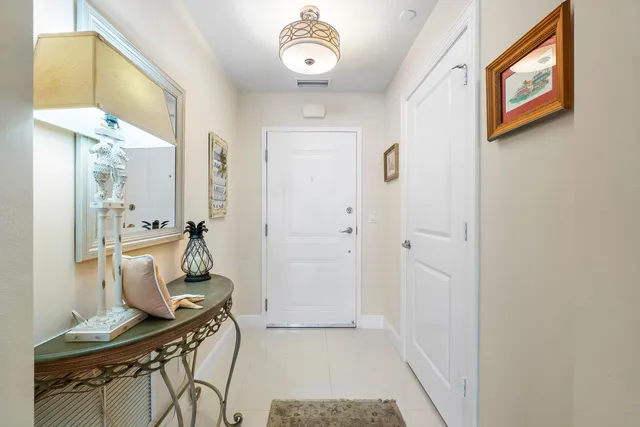 a bathroom with a granite countertop sink mirror vanity and toilet