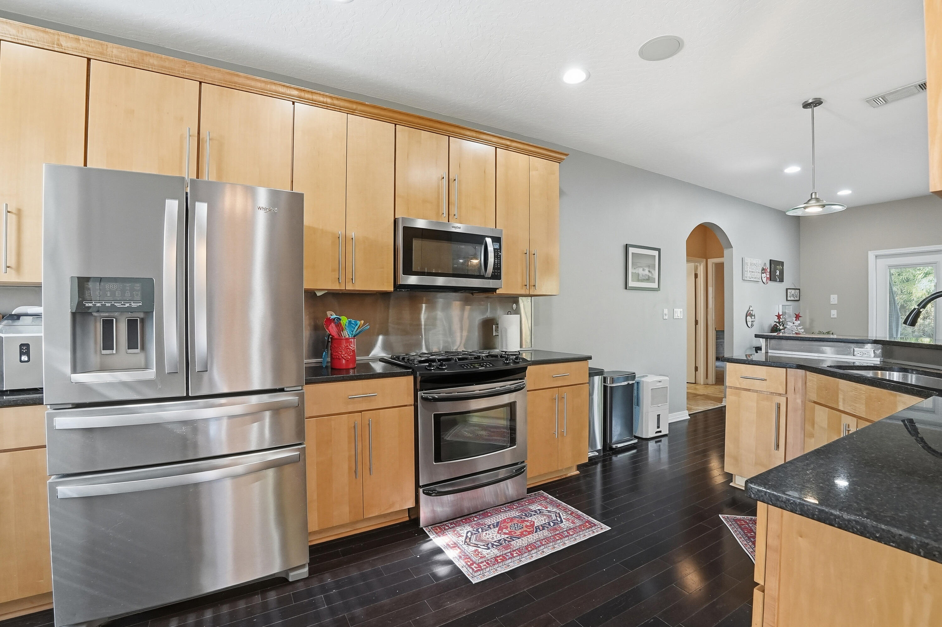 1961 Chesapeake Ridge Fort Walton Beach, FL 32547 - Photo 21 of 47 a kitchen with stainless steel appliances granite countertop a refrigerator stove and microwave