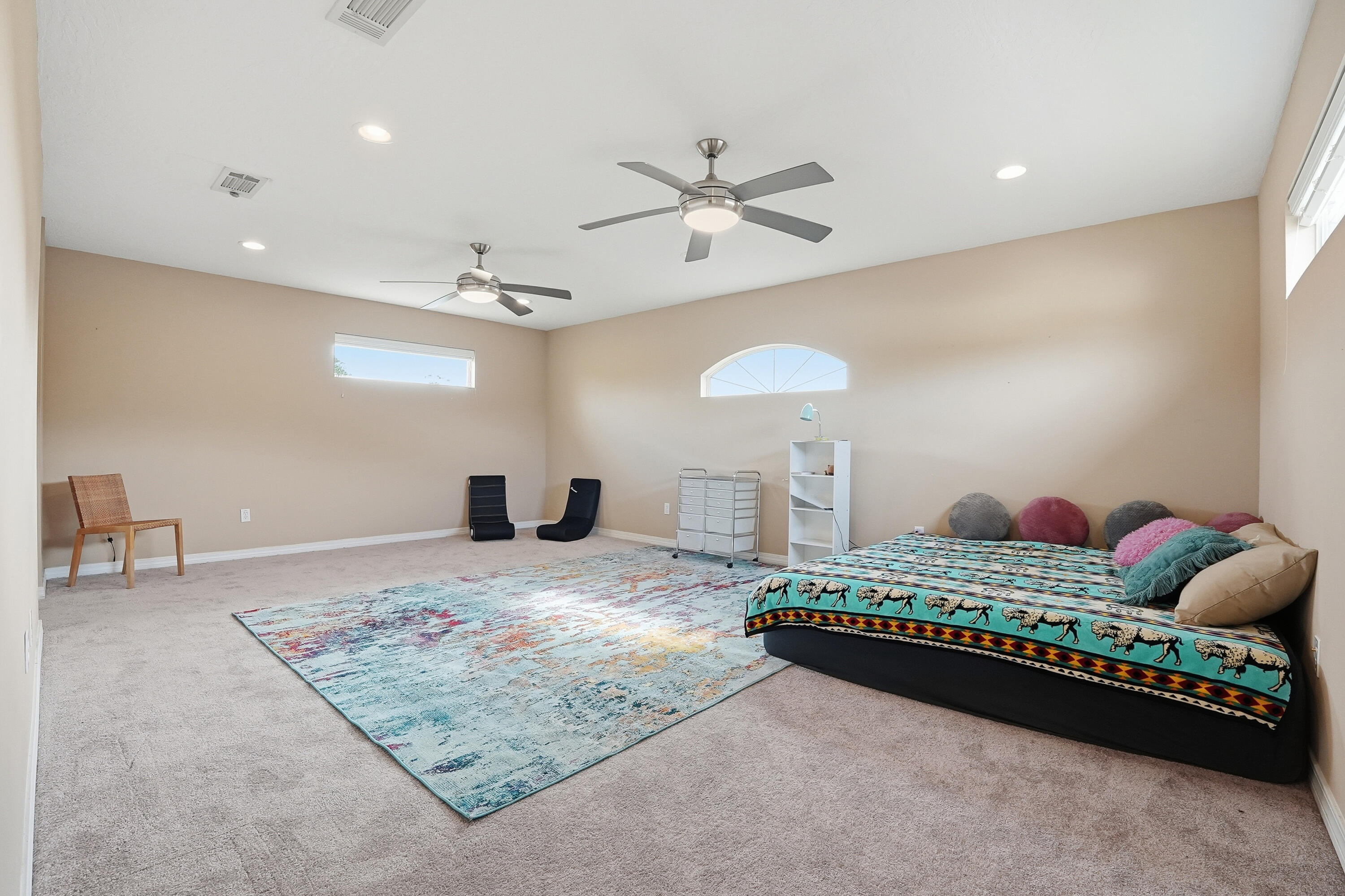 1961 Chesapeake Ridge Fort Walton Beach, FL 32547 - Photo 32 of 47 a bedroom with a bed and a chandelier