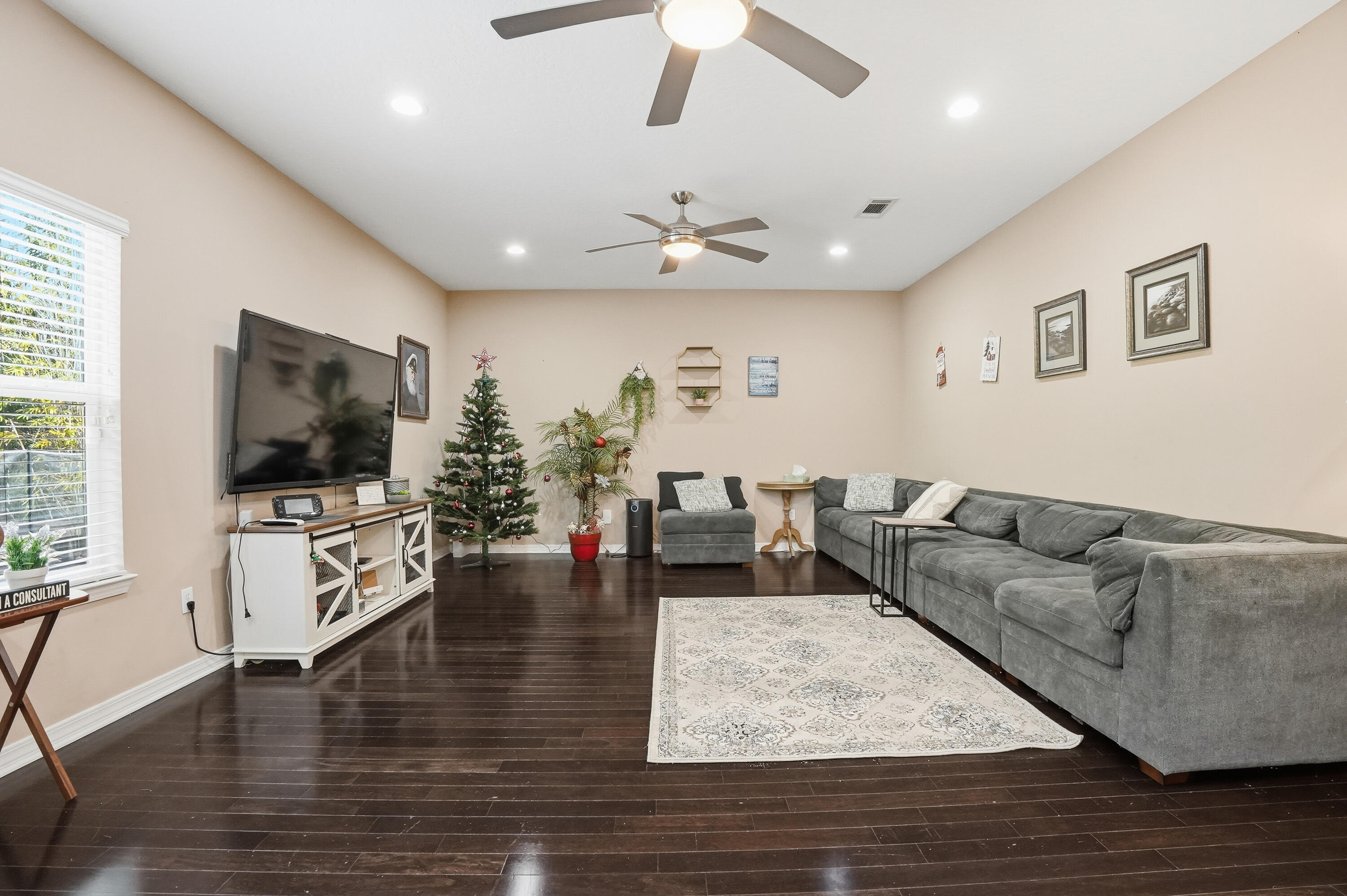 1961 Chesapeake Ridge Fort Walton Beach, FL 32547 - Photo 6 of 47 a living room with furniture and a flat screen tv
