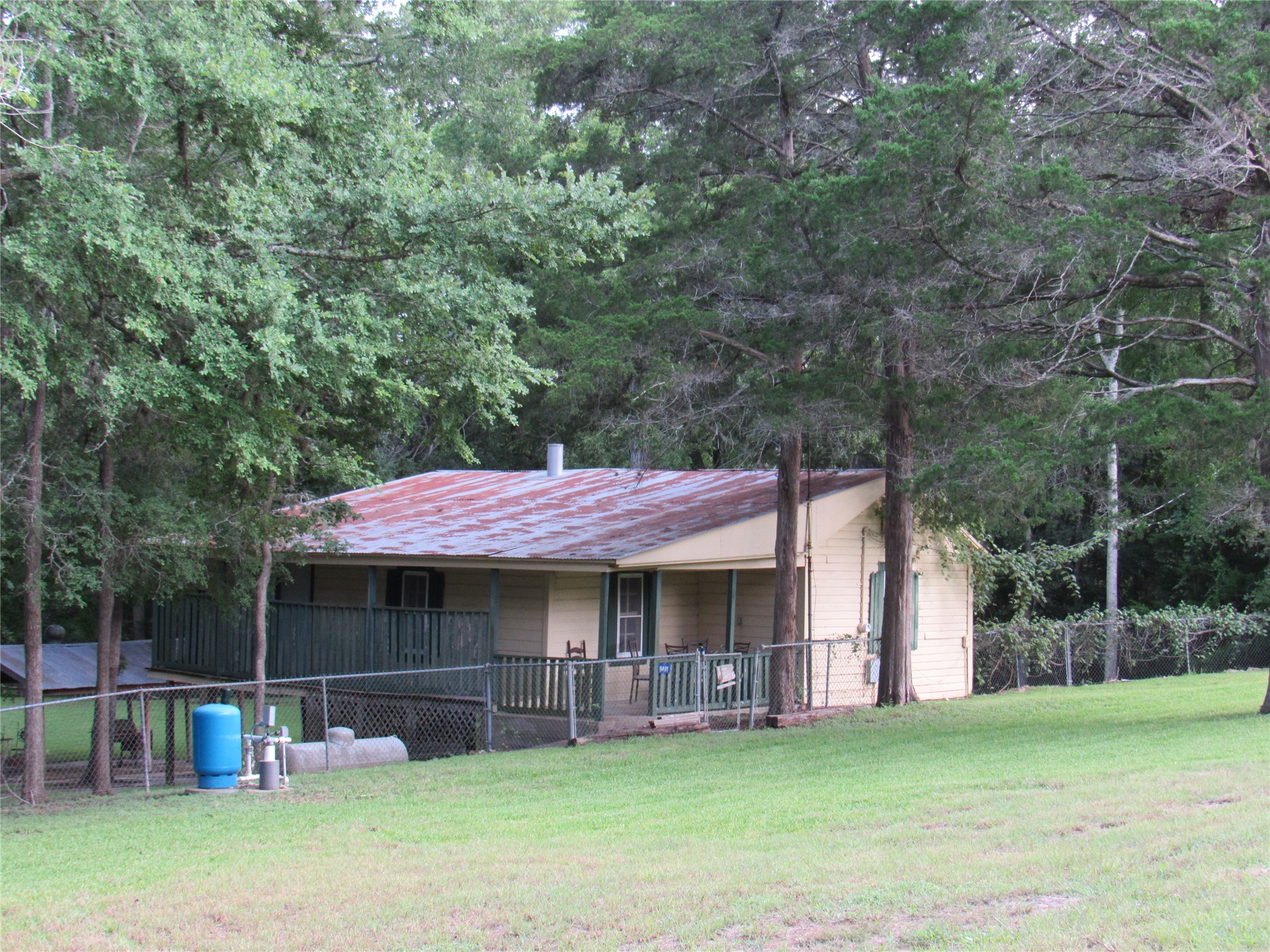 9491 Rocky Road Bellville, TX 77418 - Photo 19 of 19 a view of a house with a yard and sitting area
