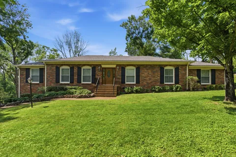 front view of a house that has a yard