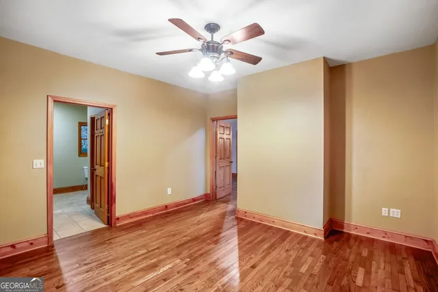 a bathroom with a sink toilet vanity and shower