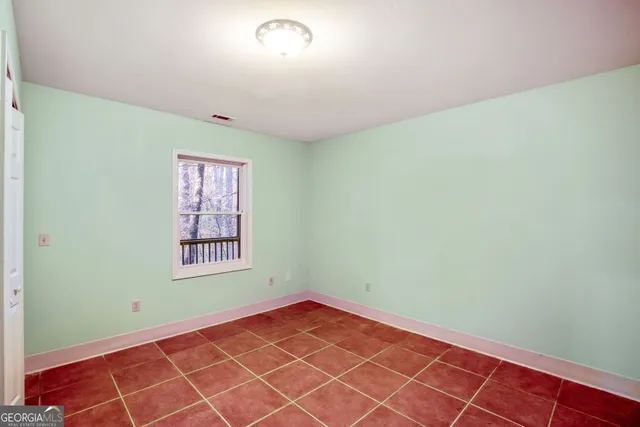 a view of deck with wooden floor and trees