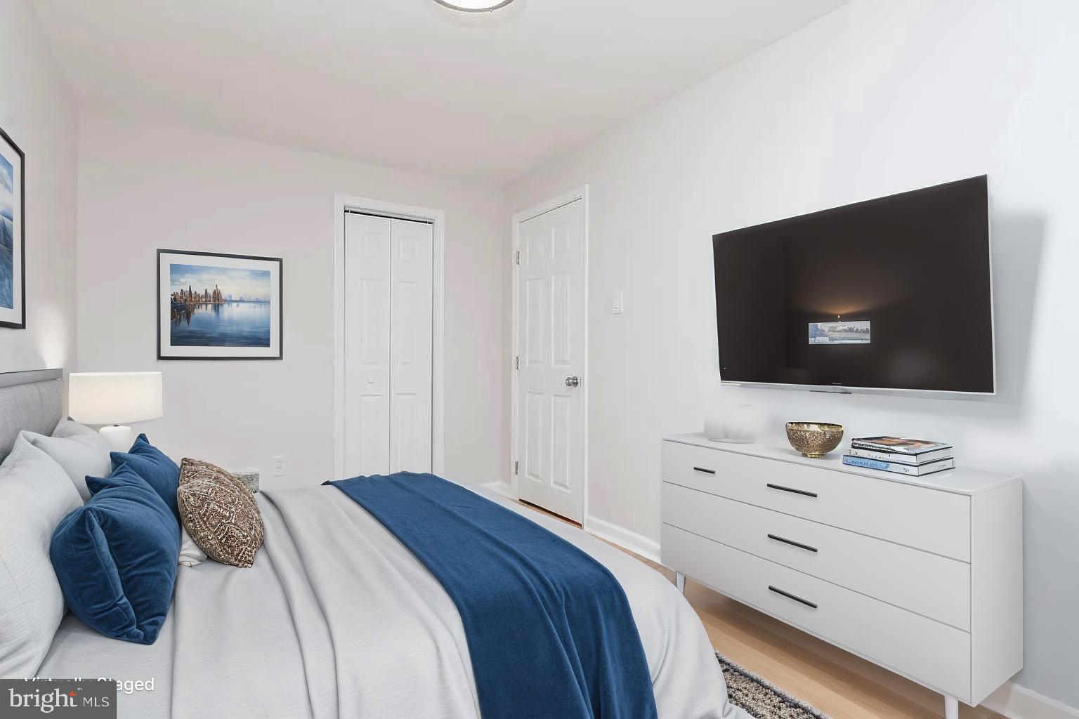 204 Kingston Road Middle River, MD 21220 - Photo 11 of 16 a bedroom with a bed and a flat screen tv