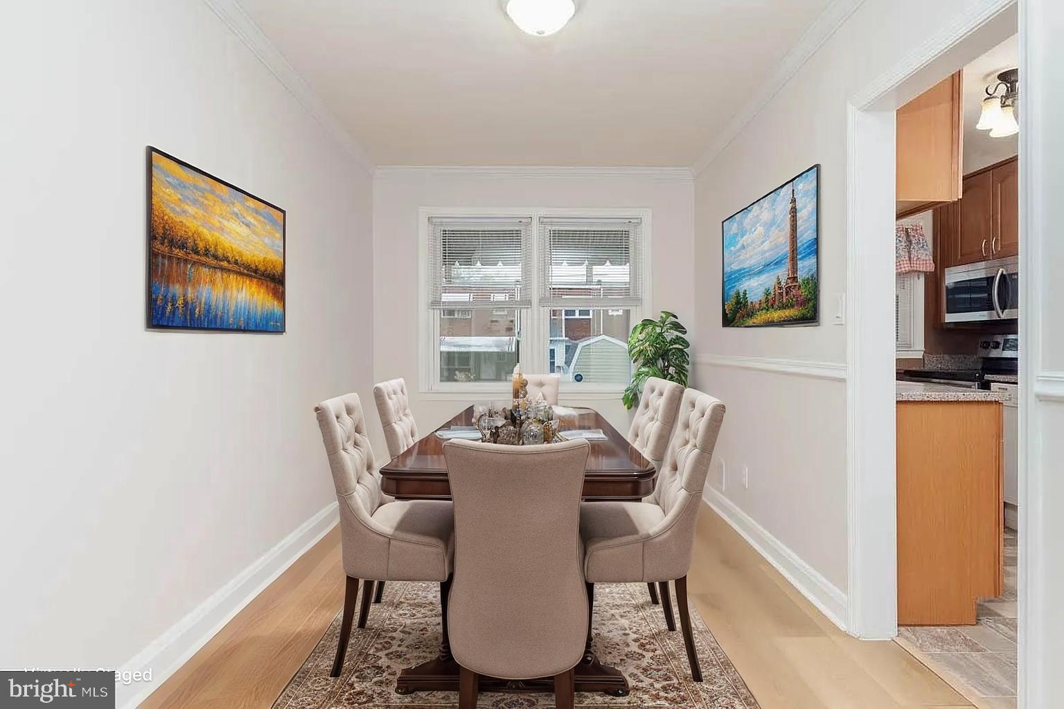 204 Kingston Road Middle River, MD 21220 - Photo 4 of 16 a dining room with furniture a window and wooden floor