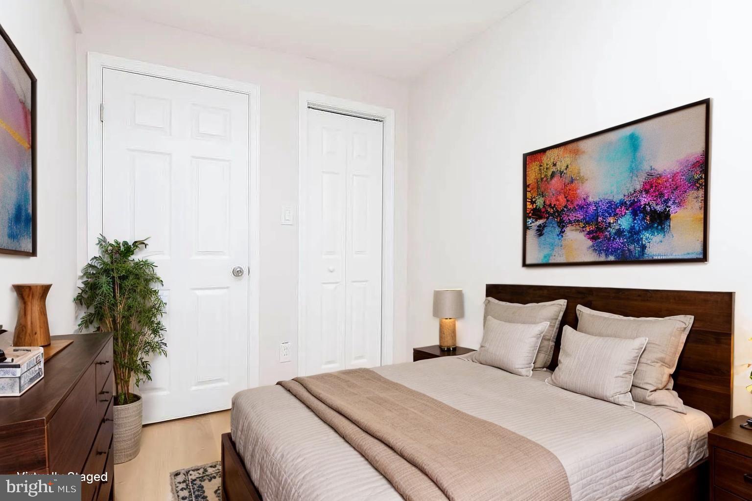 204 Kingston Road Middle River, MD 21220 - Photo 7 of 16 a bedroom with bed and paintings on the wall