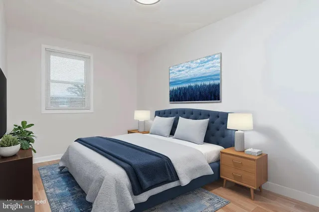 a bedroom with bed and window