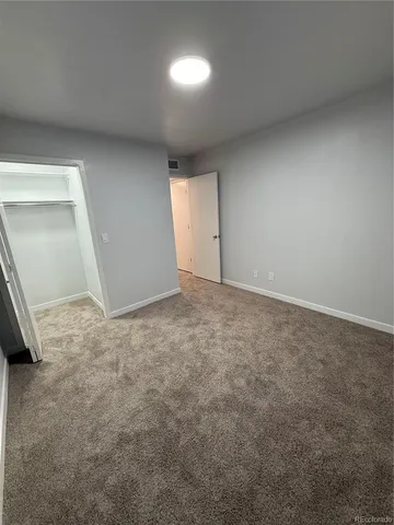 an empty room with a empty space and window