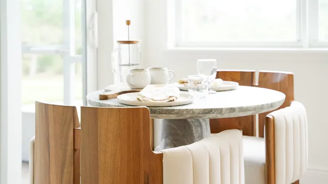 a bedroom with a bed and a table