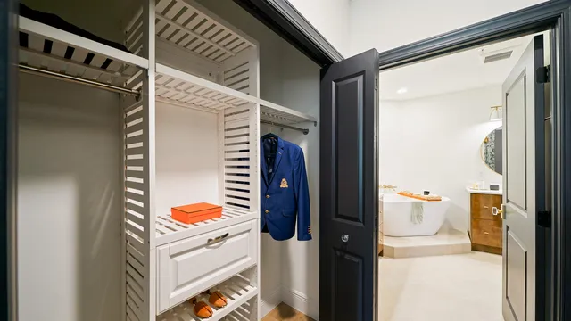 a bathroom with a sink mirror and tub