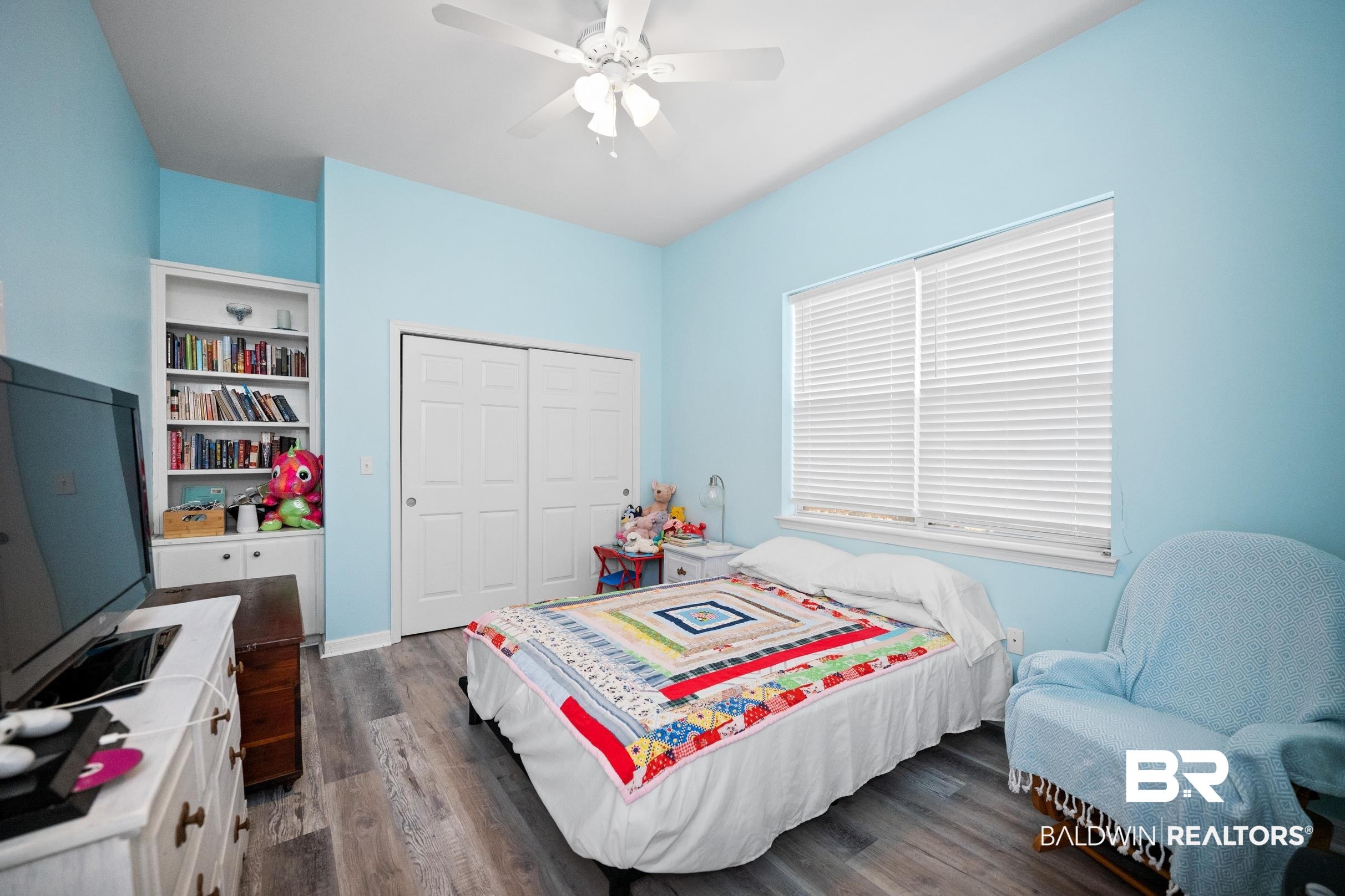 8585 Bay Harbor Road Elberta, AL 36530 - Photo 29 of 51 Bedroom featuring dark wood-style flooring, a closet, and ceiling fan