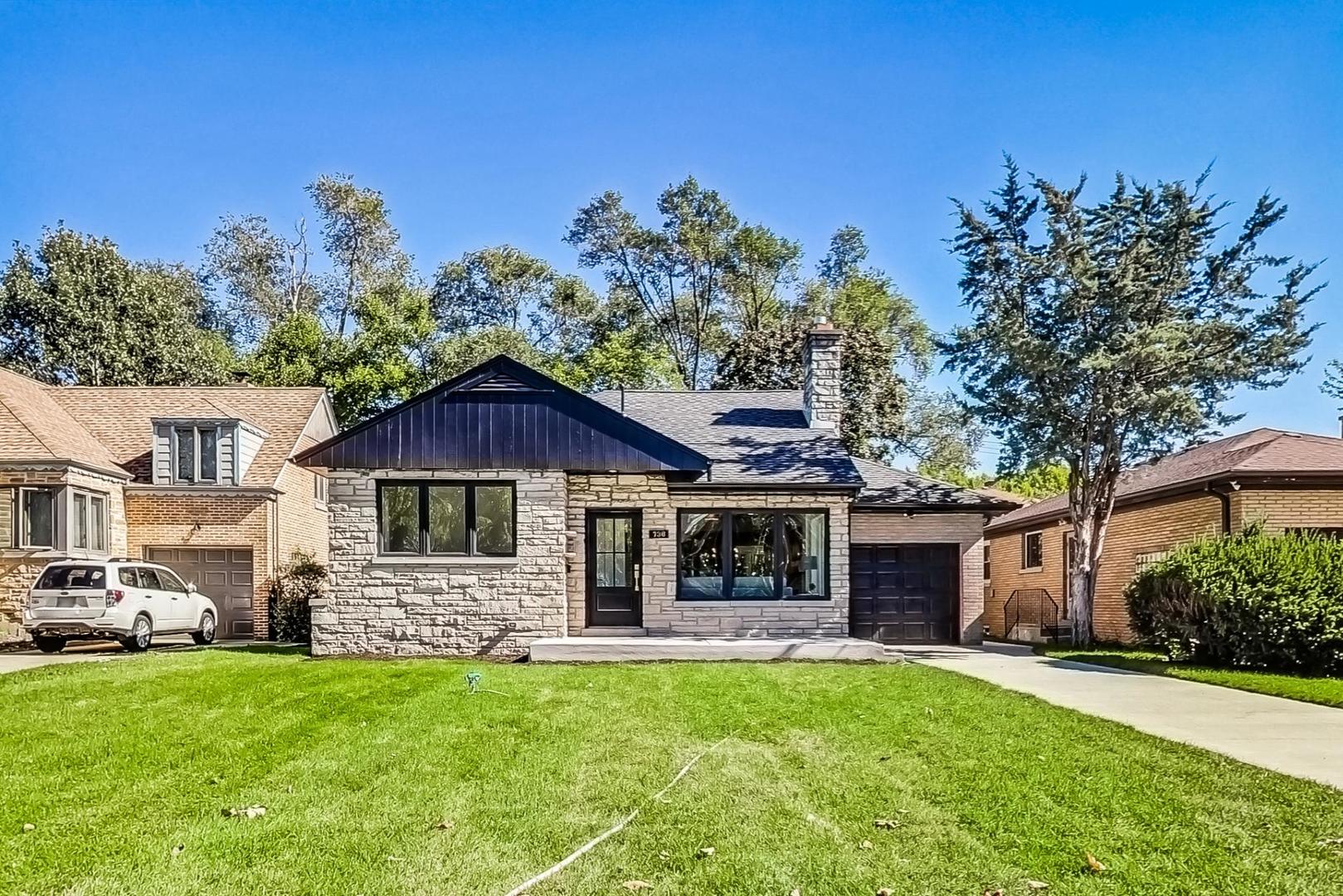 736 Selborne Road Riverside, IL 60546 - Photo 1 of 36 a front view of a house with a garden