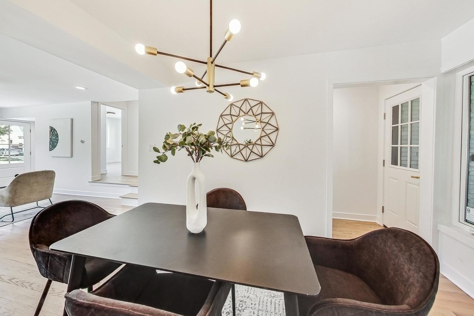 736 Selborne Road Riverside, IL 60546 - Photo 6 of 36 a view of a dining room with furniture and wooden floor