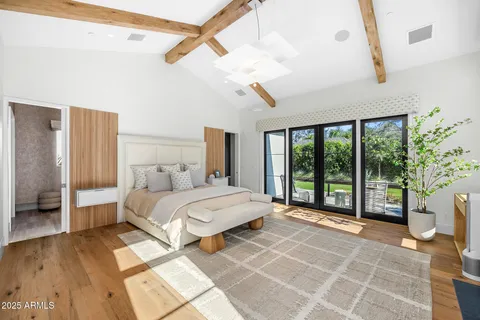 a bedroom with a bed and window