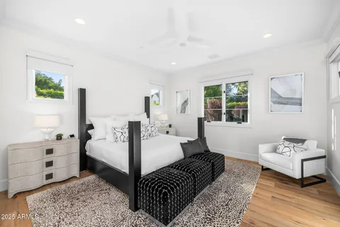 a spacious bedroom with a bed and a couch