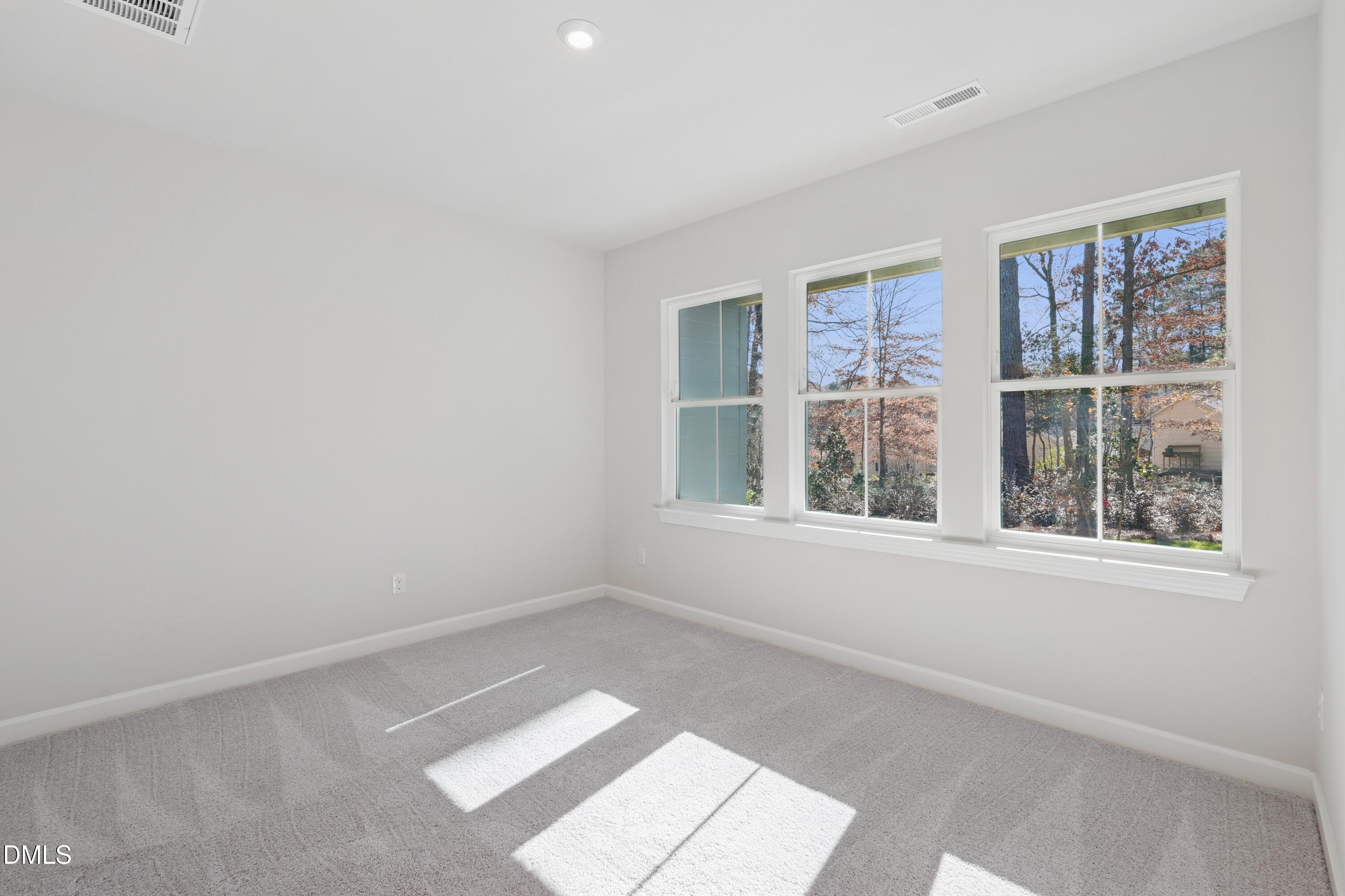 4607 Mint Leaf Lane Raleigh, NC 27612 - Photo 10 of 17 a view of an empty room with a window