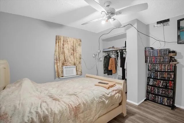 a bedroom with a large bed and a window