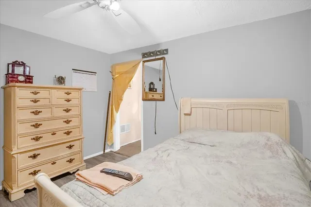 a view of a bedroom with cabinet and cabinet