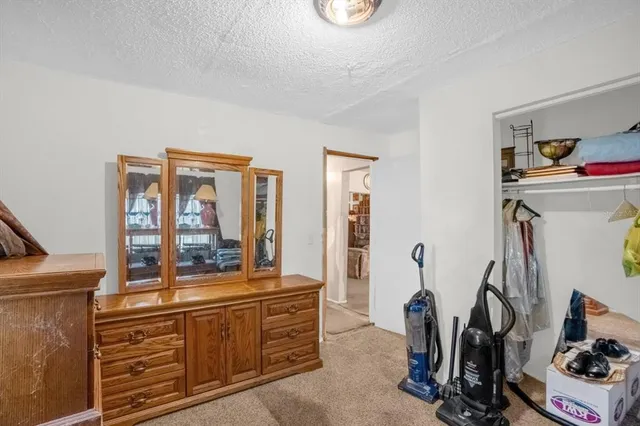 a room with gym equipment and large mirror
