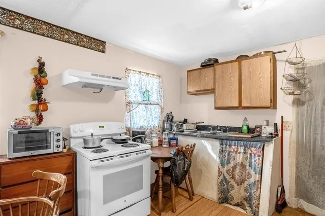 a kitchen with stainless steel appliances granite countertop a stove and a sink