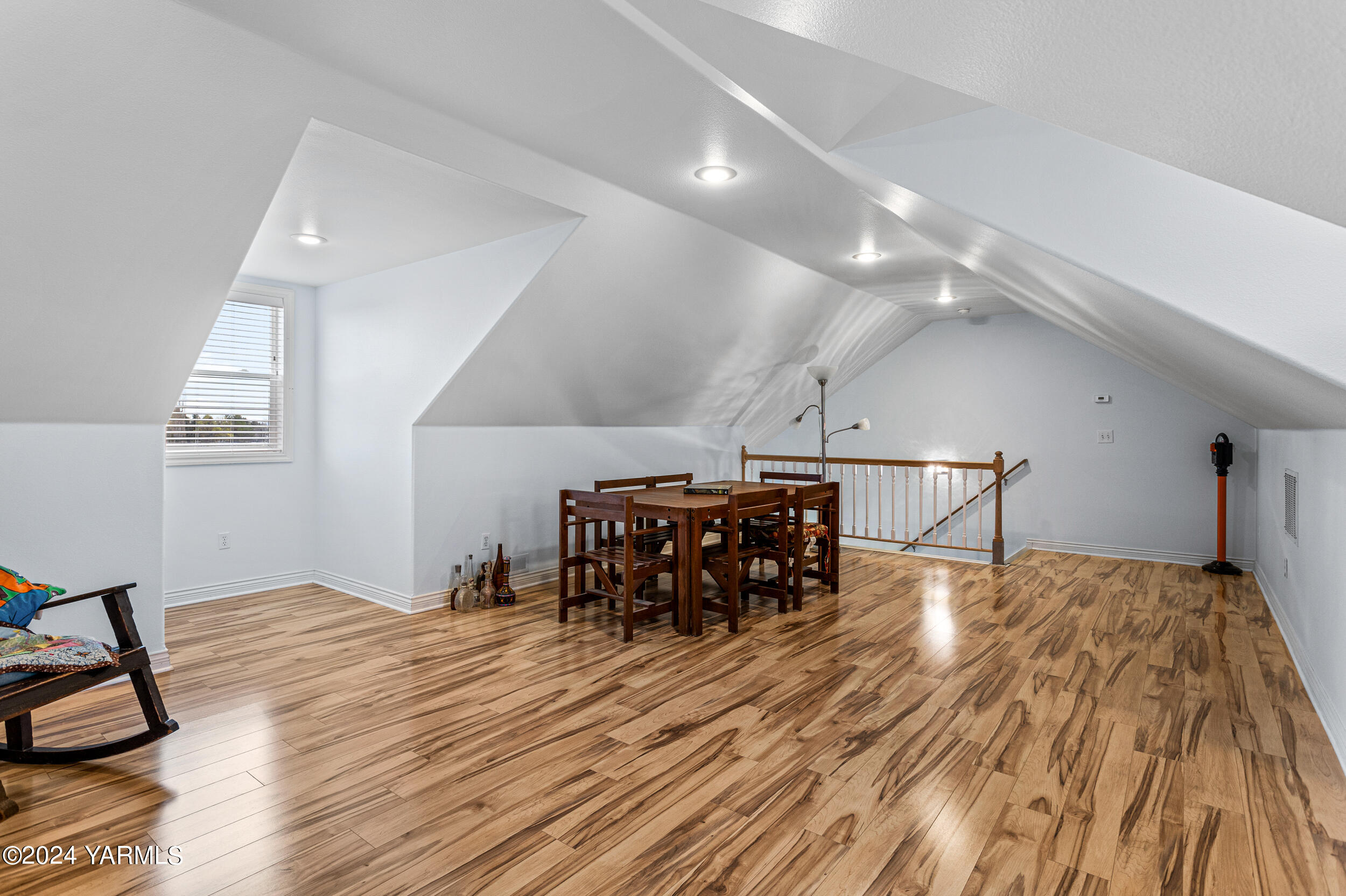 652 South Friedline Road Yakima, WA 98908 - Photo 30 of 38 a bed room with a bed and a chandelier