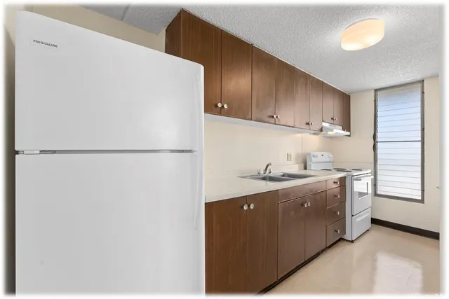 a bathroom with a sink a toilet and bathtub