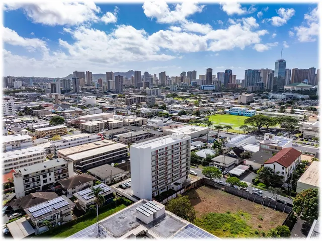 a white kitchen with stainless steel appliances a sink and a refrigerator